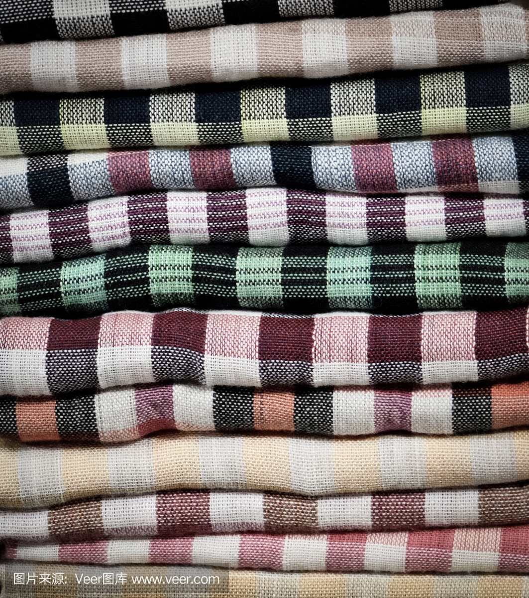 彩色的毛巾,尿布,折叠的纺织品,布作为背景